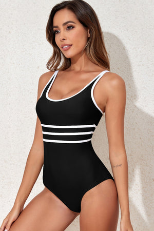 Black one-piece swimsuit with white stripe trim and scoop neckline.