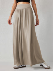 Khaki jersey wide-leg trousers with a drape-front waistband and flowy silhouette.