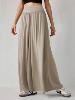 Khaki jersey wide-leg trousers with a drape-front waistband and flowy silhouette.