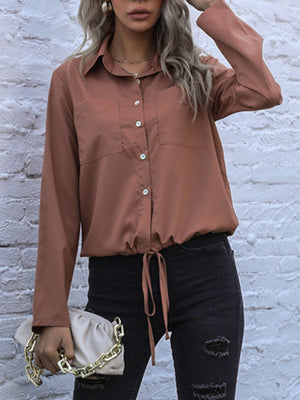 Caramel drawstring waist utility shirt with buttoned pockets and cuffs.