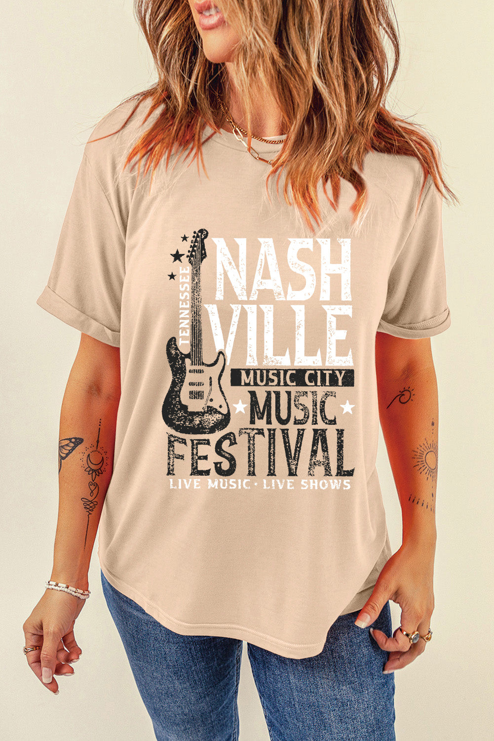 Tan graphic tee with Nashville Music Festival print and guitar detail