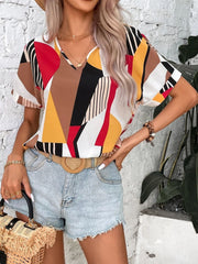 Geometric print V-neck blouse with short sleeves in multicolor.