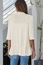 Ivory waterfall cardigan with asymmetric ruffled hem and 3/4 sleeves.