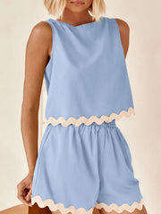 Pastel blue sleeveless crop top and shorts set with scalloped trim
