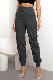 Charcoal utility cargo jogger trousers with elastic cuffs and button-tab pockets.
