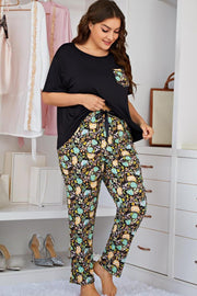 Black lounge set with botanical print pants and contrast pocket tee