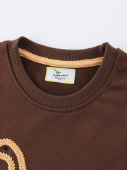 Dark brown cotton blend sweatshirt with dinosaur embroidery detail and crew neck.