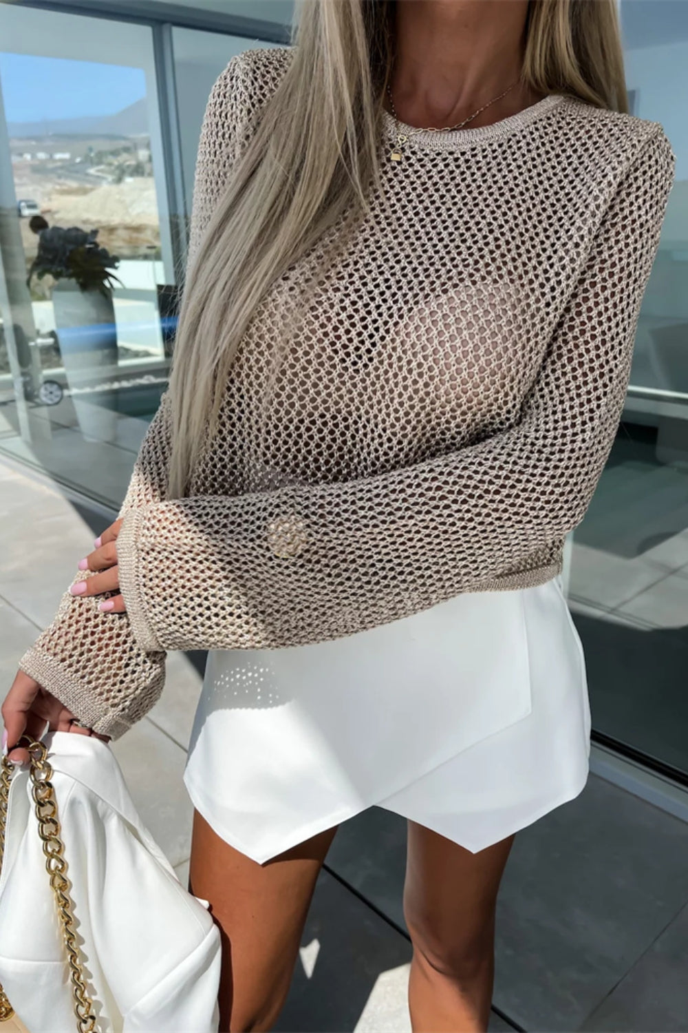 Openwork crochet sleeve top in mocha acrylic with a crew neck and long sleeves.