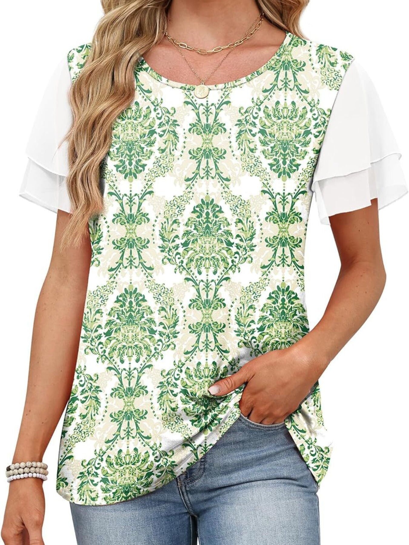 Green floral t-shirt with layered ruffled white short sleeves and a crew neck.