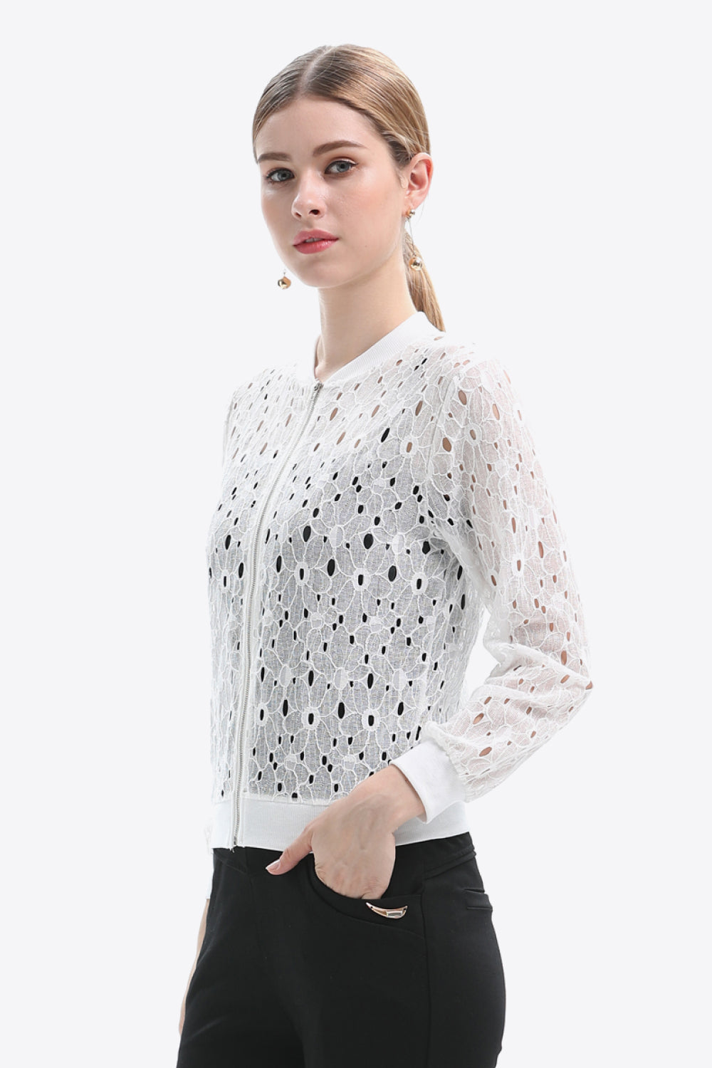 White lace-cut bomber jacket with a zip front and long sleeves.
