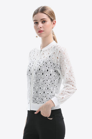 White lace-cut bomber jacket with a zip front and long sleeves.