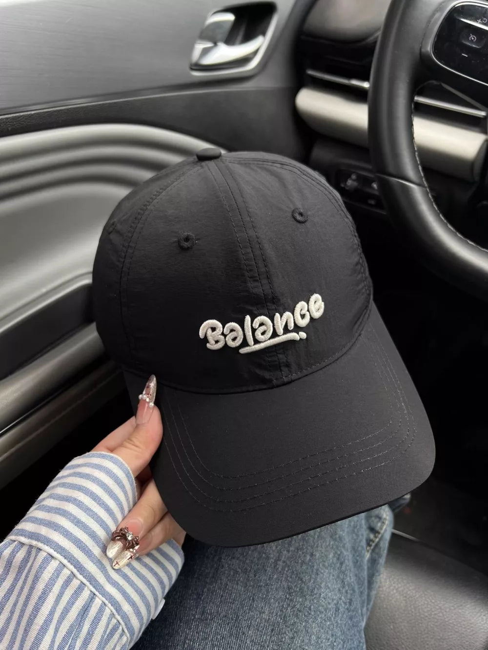 Black cotton baseball cap with embroidered Balance logo