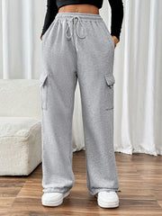 Light gray wide-leg sweatpants with cargo pockets and adjustable drawstring waist.