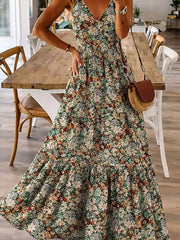Floral tiered maxi dress with spaghetti straps in Black Forest, featuring a v-neck and ruffled hem.