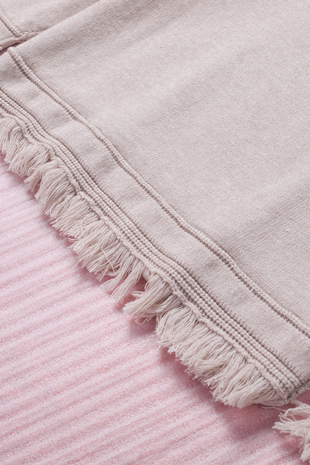 Off-the-shoulder knit sweater in eggshell with fringe trim detail