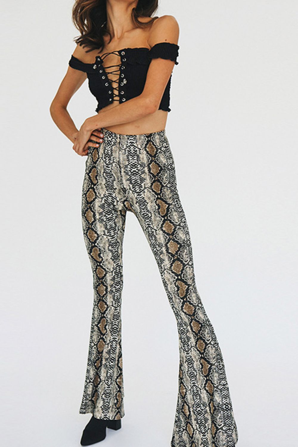 Bell-bottom pants in snakeskin print with a second-skin fit.