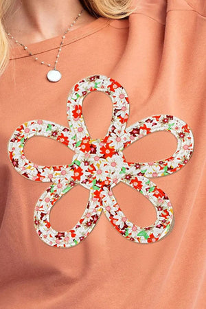 Floral appliqué sweatshirt in Sherbet with a colorful floral print detail.