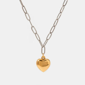 Two-tone chain necklace with a polished gold heart pendant.