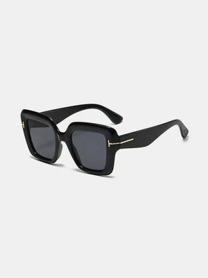 Black geometric acetate sunglasses with gold accent and tinted lenses