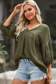 Army green textured gauze blouse with gathered voluminous sleeves and V-neck
