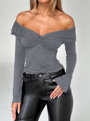 Dark gray ruched off-shoulder top with twisted knot detail and lettuce trim.