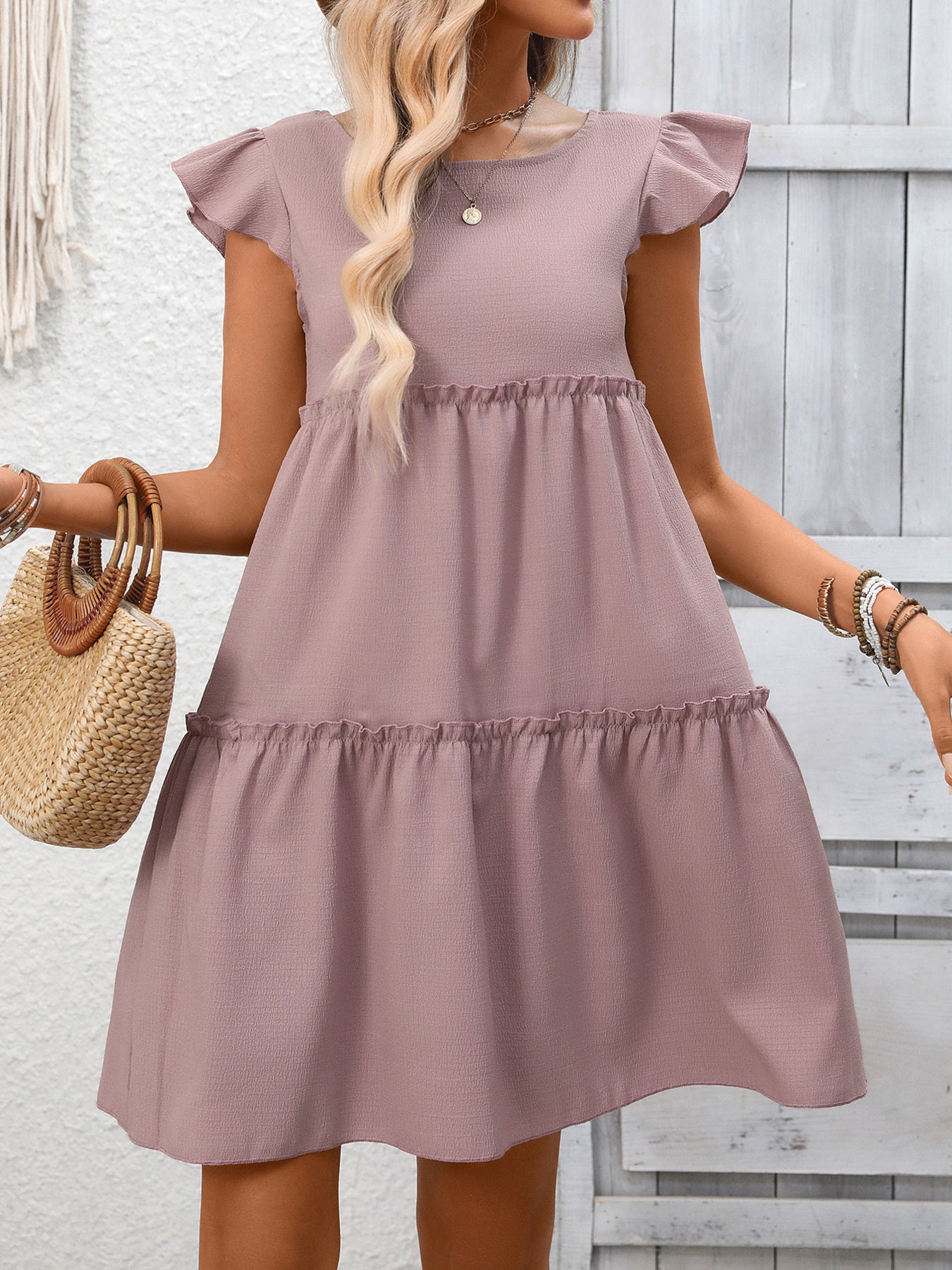 Light Purple ruffled cap sleeve mini dress with tiered skirt detail.