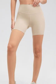Tan ribbed contour active bike shorts with a high waist and v-cut detail.