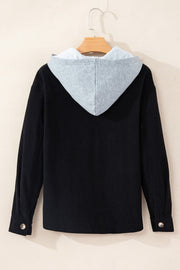 Black corduroy shirt jacket with contrast light gray hood and button cuffs.