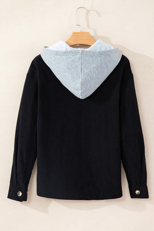 Black corduroy shirt jacket with contrast light gray hood and button cuffs.