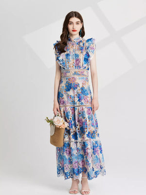 Maxi dress with floral lace, cutout details, and ruffled sleeves in blue and pink purple.