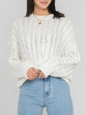 White cable knit sweater with openwork details and crew neck.