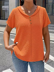 Orange textured short sleeve blouse with button detail and collared neckline.