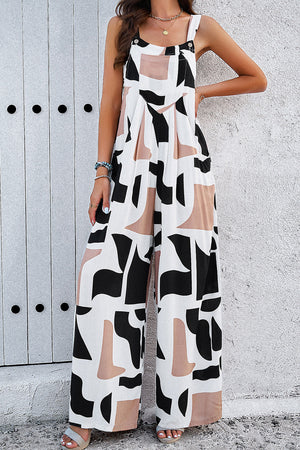 Abstract print wide leg jumpsuit with a square neckline and button straps.