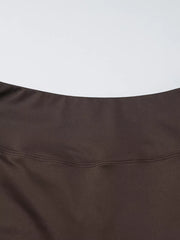 Brown halter crop top and wide-leg pants set detail showing stitching.