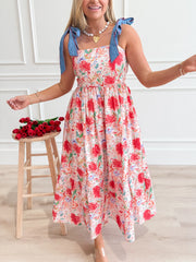 Floral print midi dress with tie-shoulder straps and a square neckline.