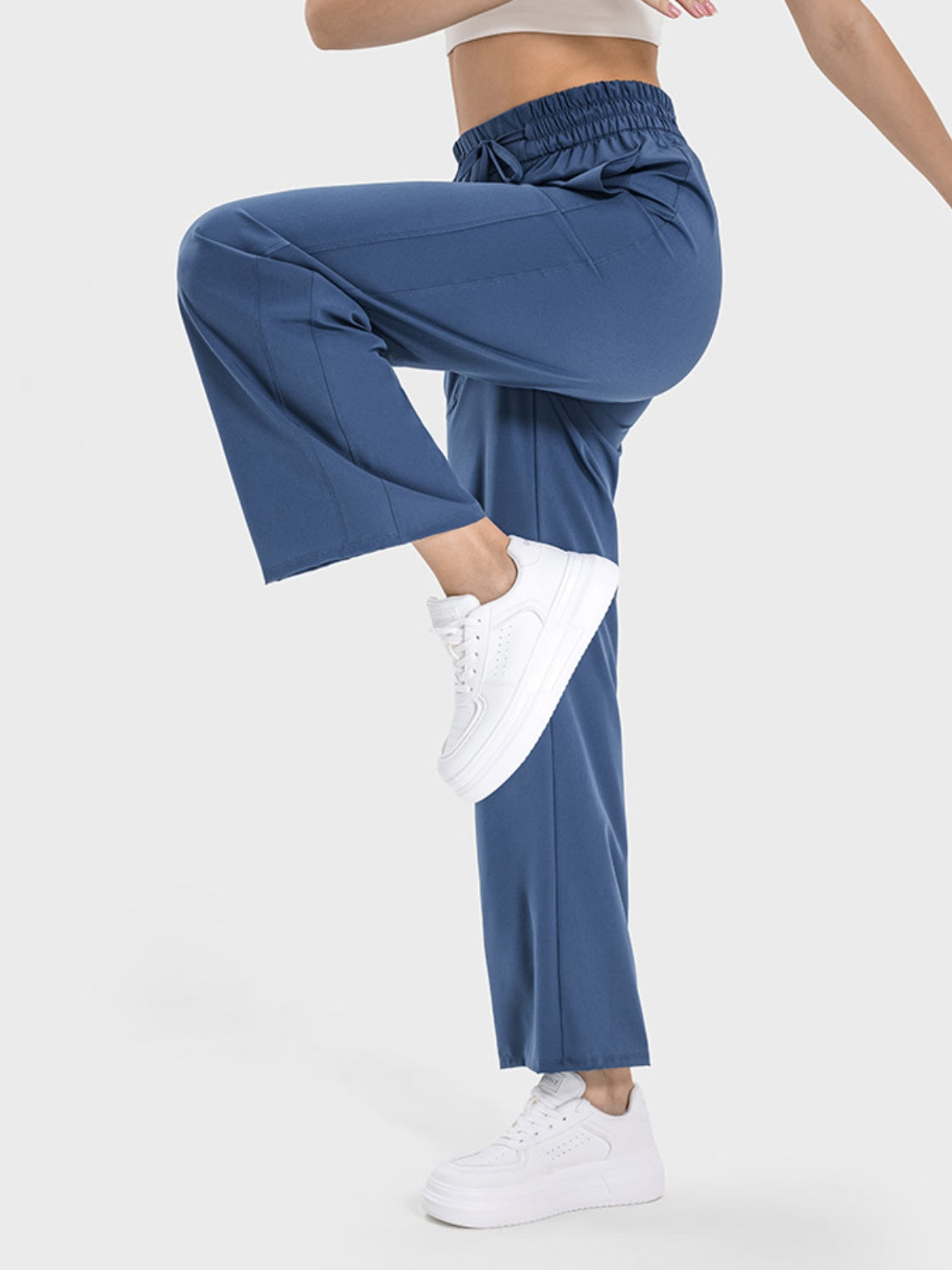 Relaxed drape drawstring palazzo pants in Dusty Blue with a cinched waist and wide leg.