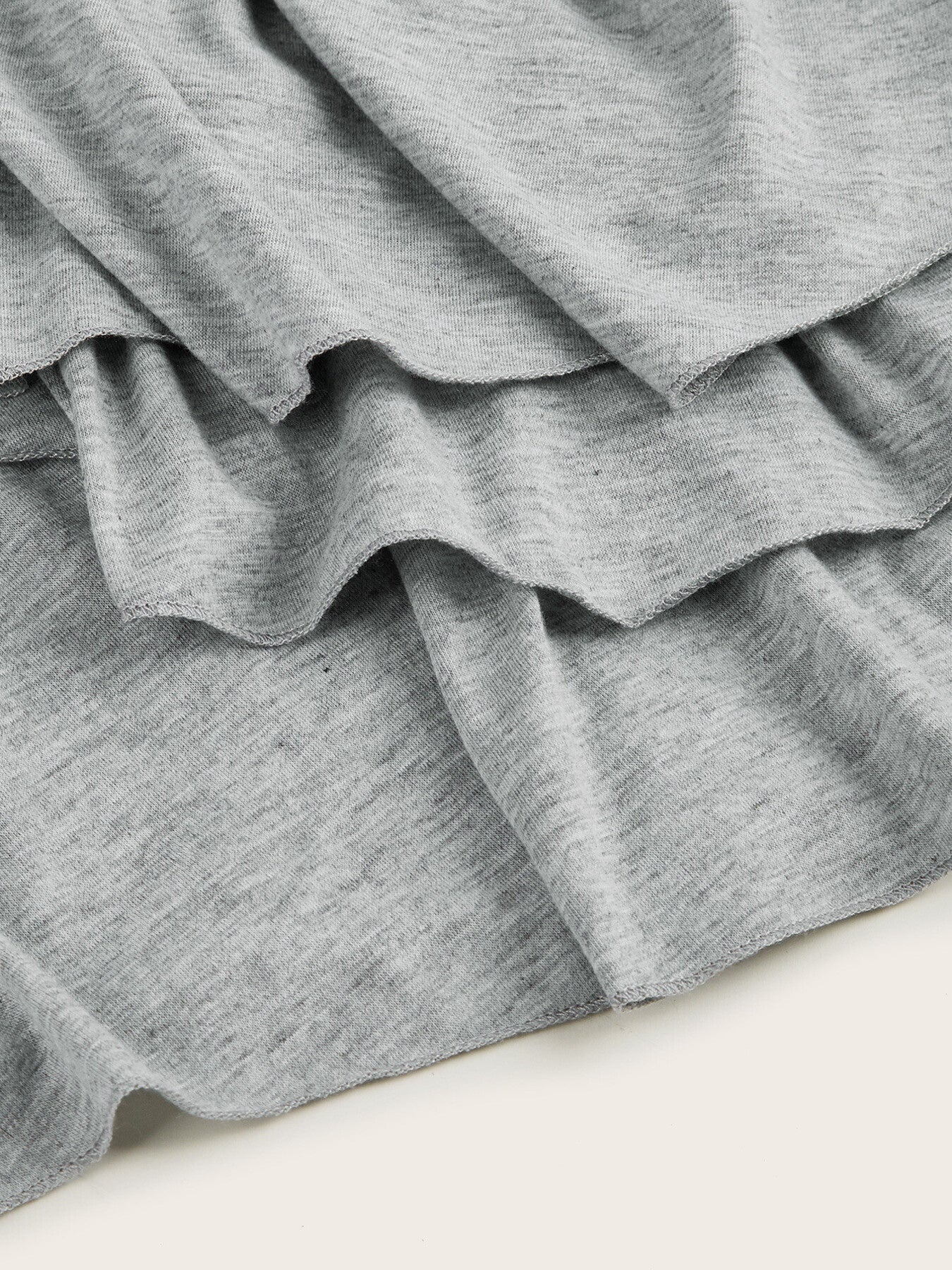 Light gray tiered midi dress with ruffled hem detail