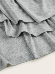 Light gray tiered midi dress with ruffled hem detail