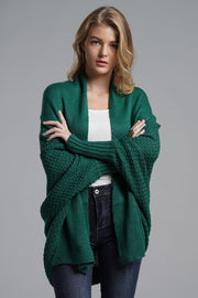 Green acrylic batwing cardigan with textured sleeves and drape front.