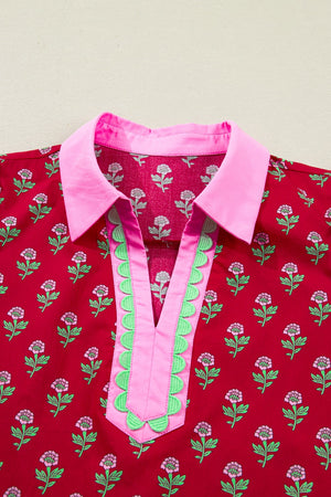 Red floral mini dress with pink collar, V-neck, and green scalloped trim