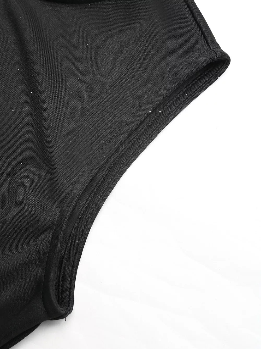 Black midi dress with subtle glitter detail on tulle fabric and self-tie belt.