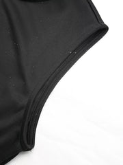 Black midi dress with subtle glitter detail on tulle fabric and self-tie belt.