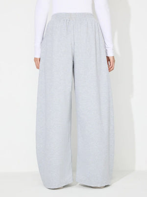 Light gray pleated drape palazzo trousers with a comfortable elastic waistband.
