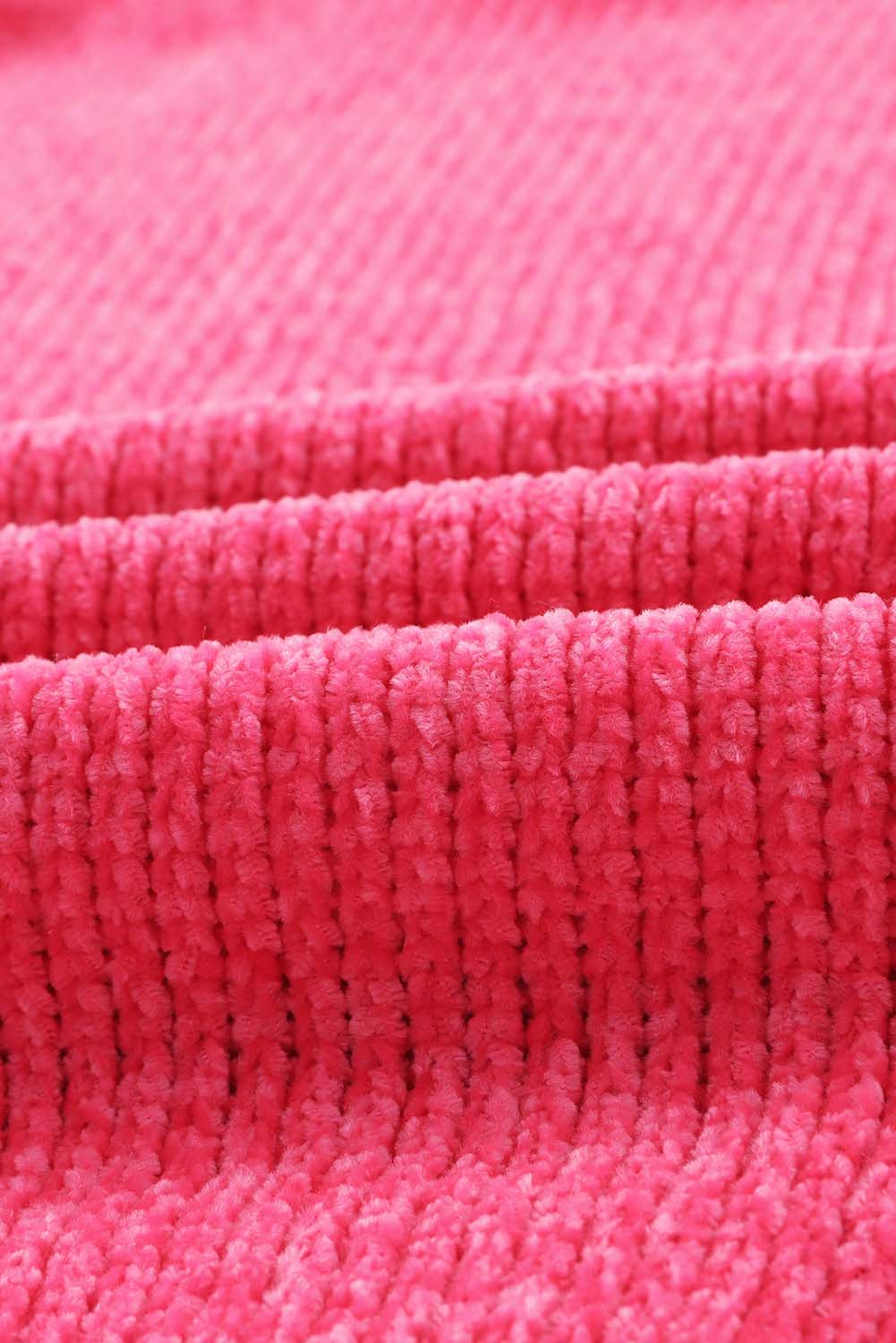 Plush pocket cardigan in hot pink with a deep V-neck and ribbed texture.