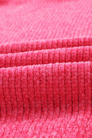 Plush pocket cardigan in hot pink with a deep V-neck and ribbed texture.