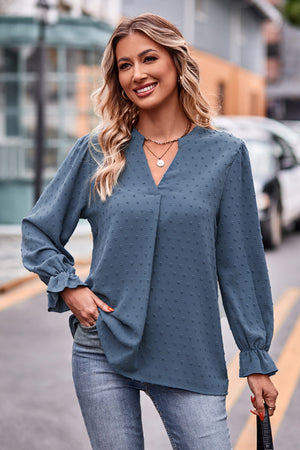 Sky blue textured dot V-neck blouse with ruffle cuffs