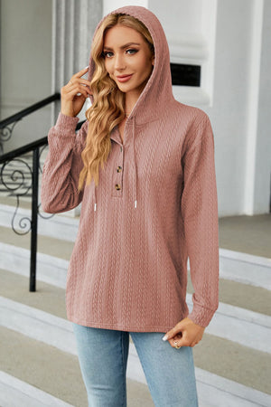 Textured henley hooded knit top in dusty pink with button detail and drawstring hood.