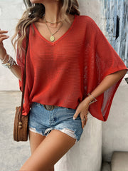 Rust open-knit dolman sleeve v-neck sweater with a relaxed fit.