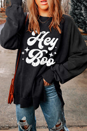 Black graphic oversized sweatshirt with "Hey Boo" print and stars, crewneck, long sleeves.