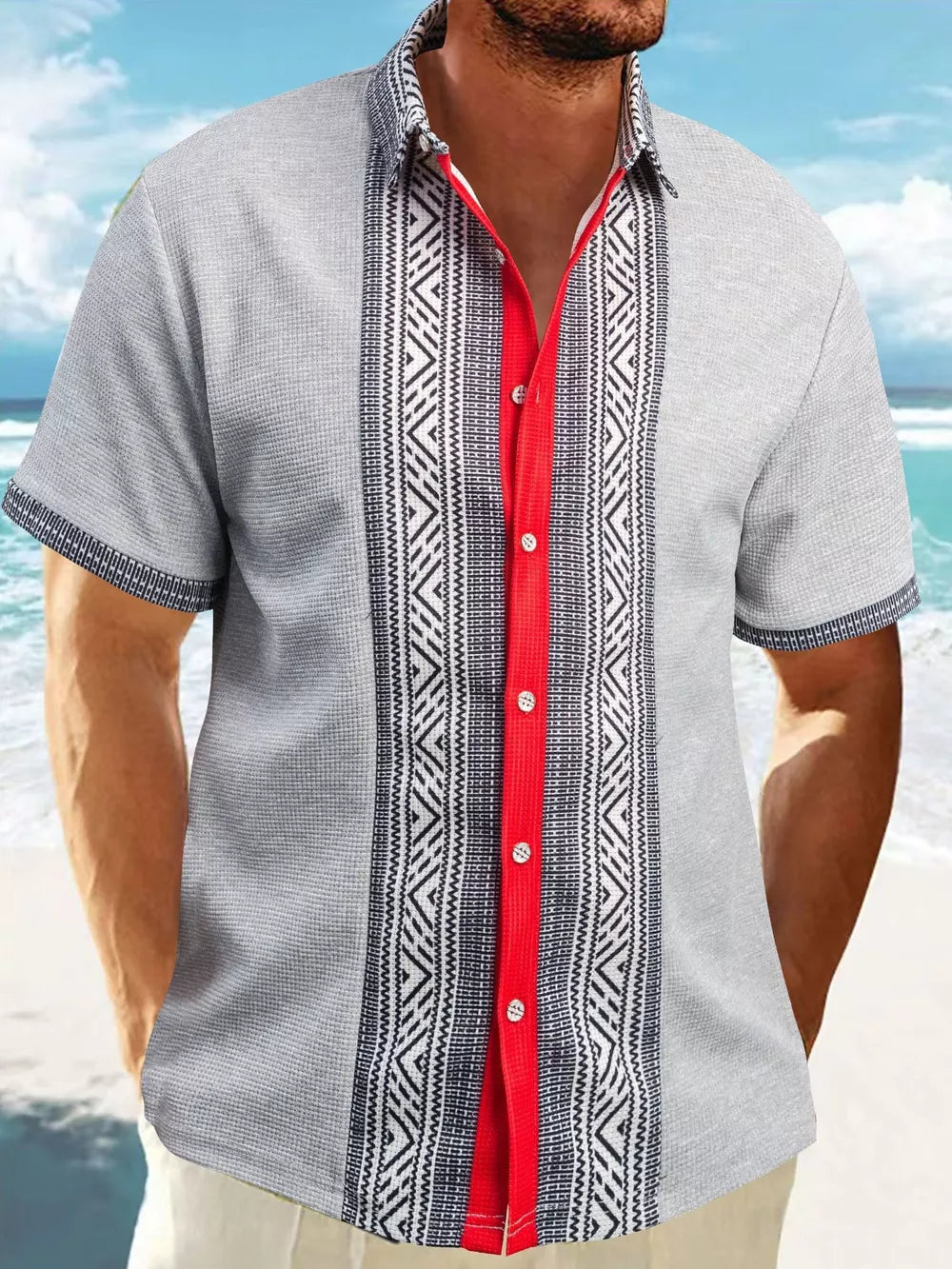 Men's gray short sleeve shirt with bold geometric print panels and red placket.